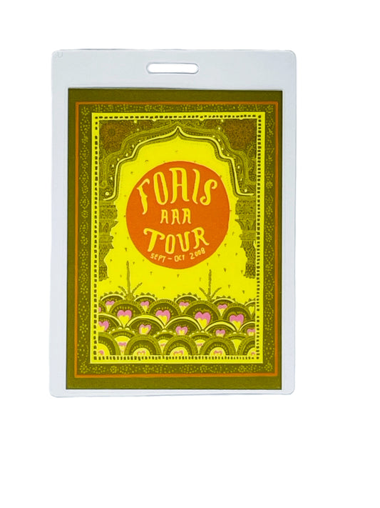 Laminated concert ticket with 'FOALS' and 'TOUR' text on a yellow background