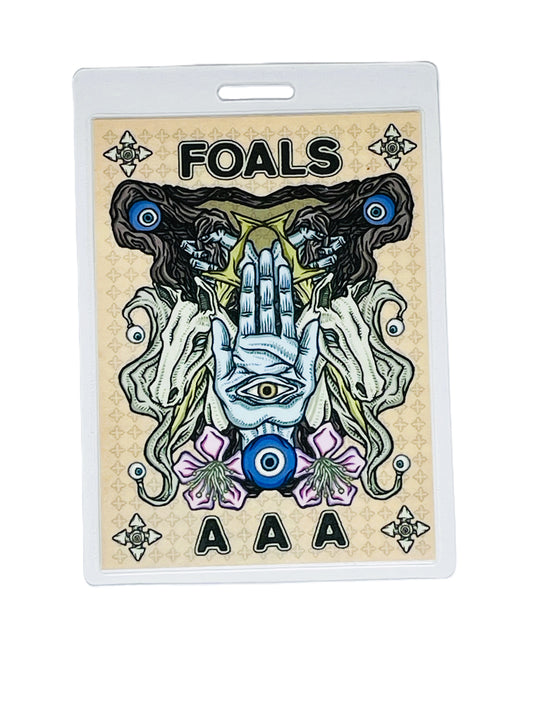 Foals concert ticket with artistic design and 'AAA' text on a beige background