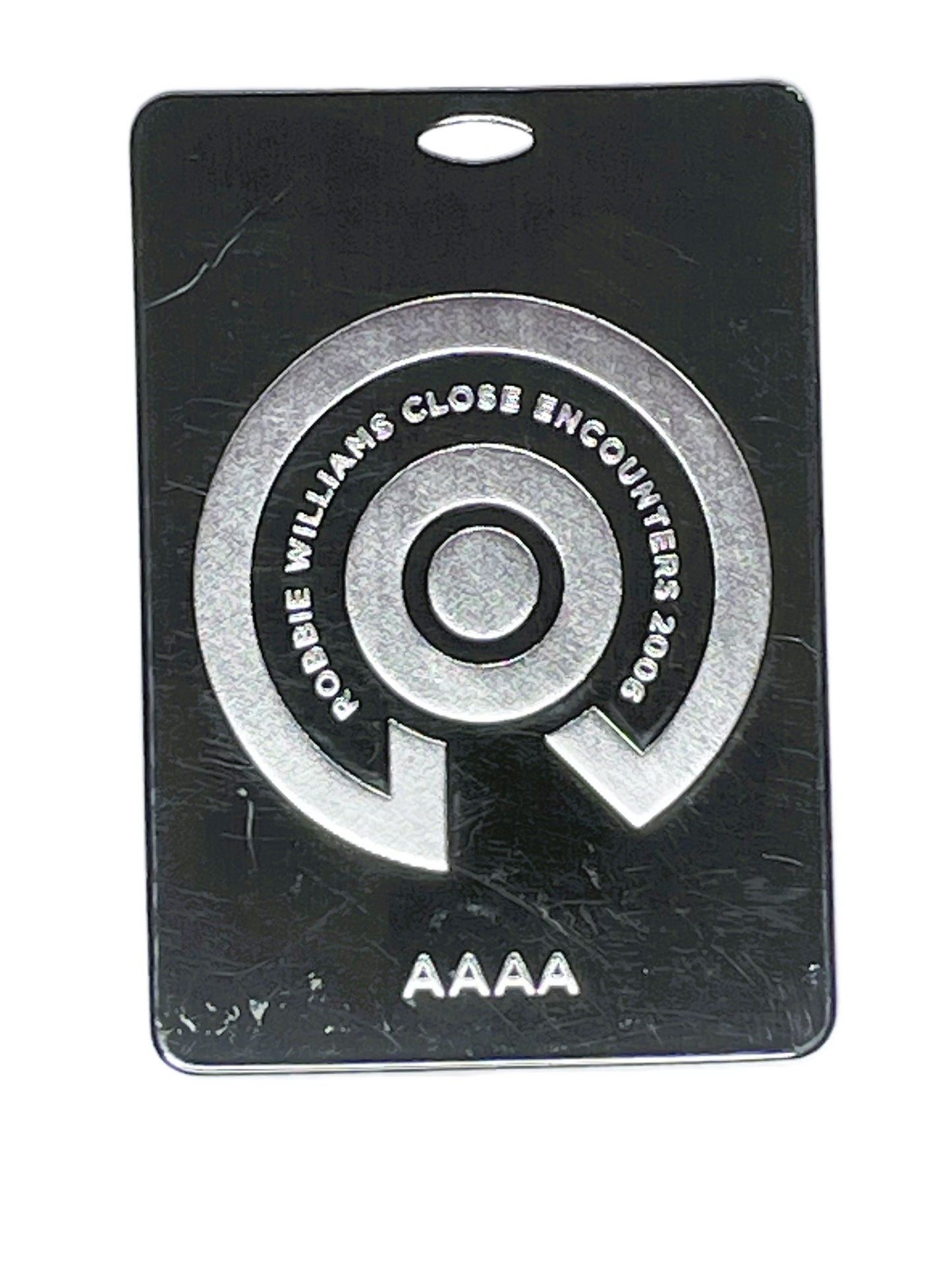 Black and silver pass with circular design and text 