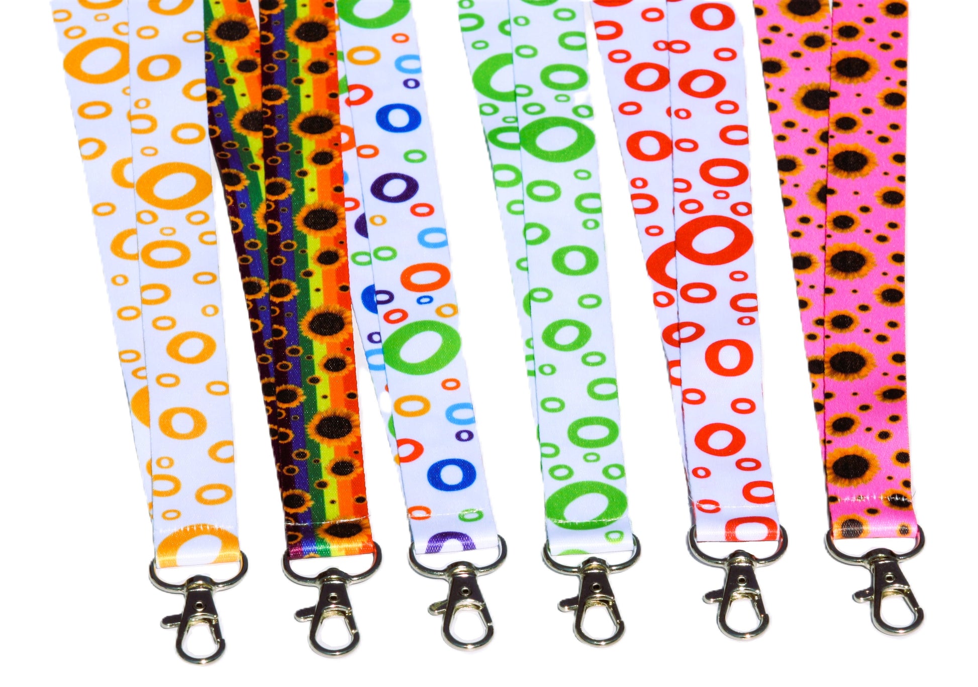 Five colorful lanyards with different patterns on a white background